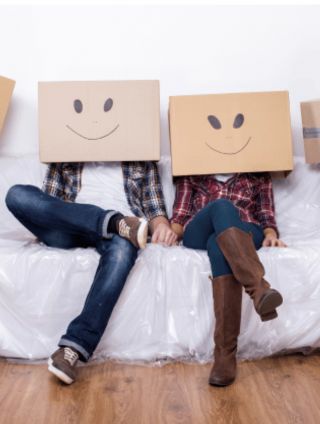 Image of two people with smiley face boxes on their heads